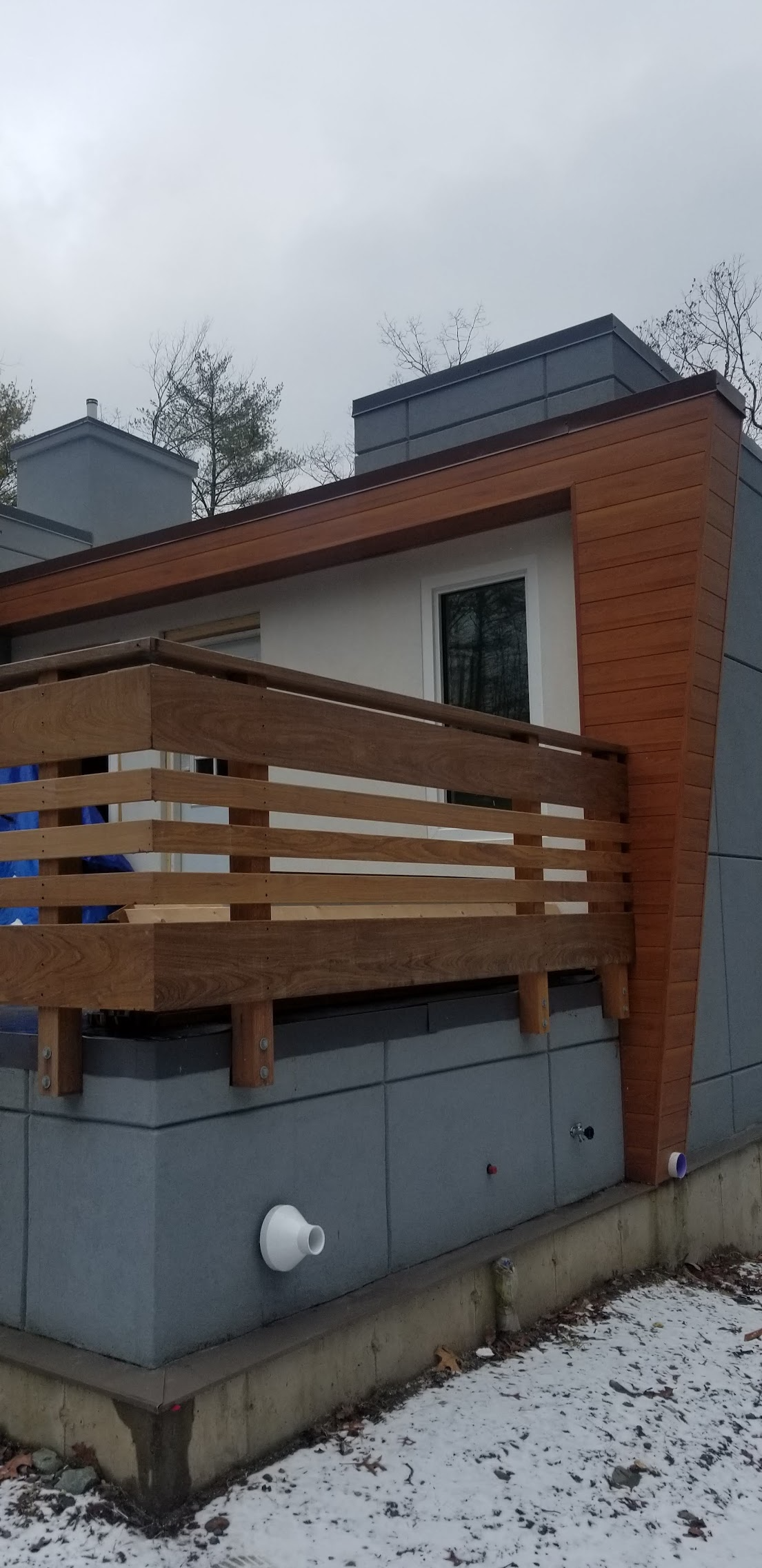 Gray and Orange House with Deck